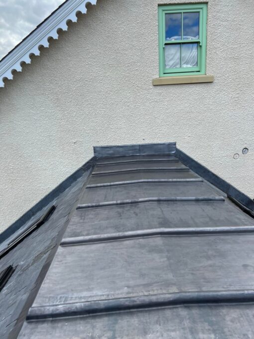 This is a photo of an extension on a house with a newly laid lead roof by Hinckley Roofing