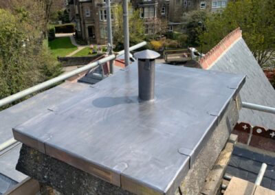 This is a photo of a chimney that has a new lead covered top. This was installed by Hinckley Roofing