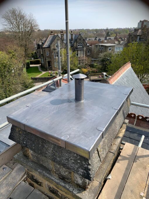 This is a photo of a chimney that has a new lead covered top. This was installed by Hinckley Roofing