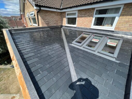 This is a photo of a house with new fascia boards and soffits. These were installed by Hinckley Roofing