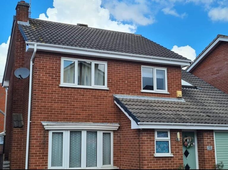 This is a photo taken of a house after a new fascia, Soffits and guttering were installed by Hinckley Roofing