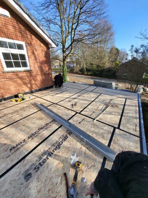 This is a photo of new cover added to a flat roof before the liquid roofing was put on top. this was done by Hinckley Roofing