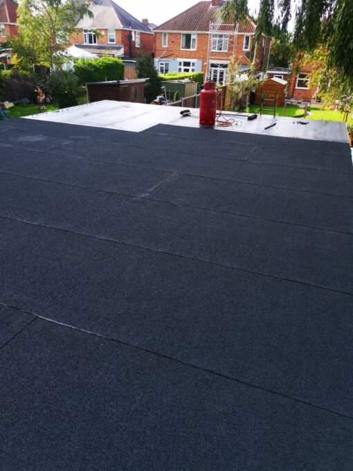 This is a photo of roofing felt being laid on a flat roof in Hinckley. This work is being done by Hinckley roofing